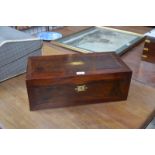 A 19th Century stained walnut writing slope with brass mounts and fitted interior with gilt-tooled