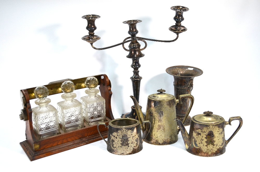 A 19th century Old Sheffield Plate large twin-branch candelabrum, a three-decanter tantalus,