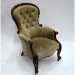 A Victorian mahogany framed button upholstered spoon back armchair