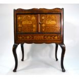 A 19th Century Dutch floral marquetry tray-top night table with two doors on cabriole supports