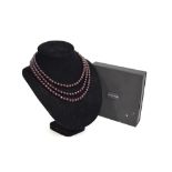 A triple row garnet bead necklace within fitted box