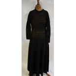 A 1970s black crocheted cotton full-length dress with narrow crocheted belt,