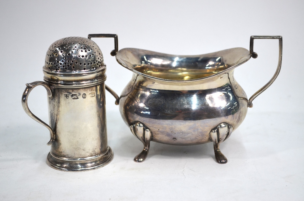 A Victorian silver sugar caster in the form of a flour dredger with scroll handle, Nathan & Hayes,