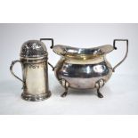 A Victorian silver sugar caster in the form of a flour dredger with scroll handle, Nathan & Hayes,