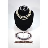 A collection of freshwater pearls including a triple row necklace,