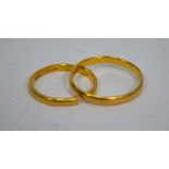 Two 22ct yellow gold wedding bands, approx 5g (2) Condition Report One broken,