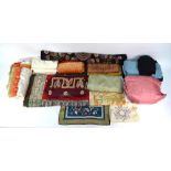Two boxes containing a collection of saris, silk and other fabric pieces, to/w a crocheted bedcover,