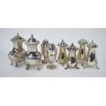 Two pairs of silver pepperettes - one with mustard-pot, to/w a pair of silver open salts,