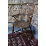 A 19th century elm seat hoop back Windsor elbow chair,