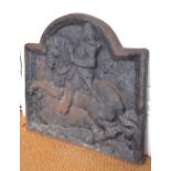 An antique sand-cast iron arched fire-back, embossed with relief equestrian portrait of George I,