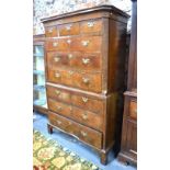 A George III cockbeaded and featherbanded walnut chest on chest, in two parts,