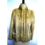 A shadowed blond mink fur jacket with two pockets to front and neru collar, size 12,
