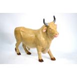 A large Volkstedt porcelain bull with faun glazed body,