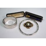 A silver half engraved hinged bangle to/w silver bamboo style bangle to/w a mourning brooch and