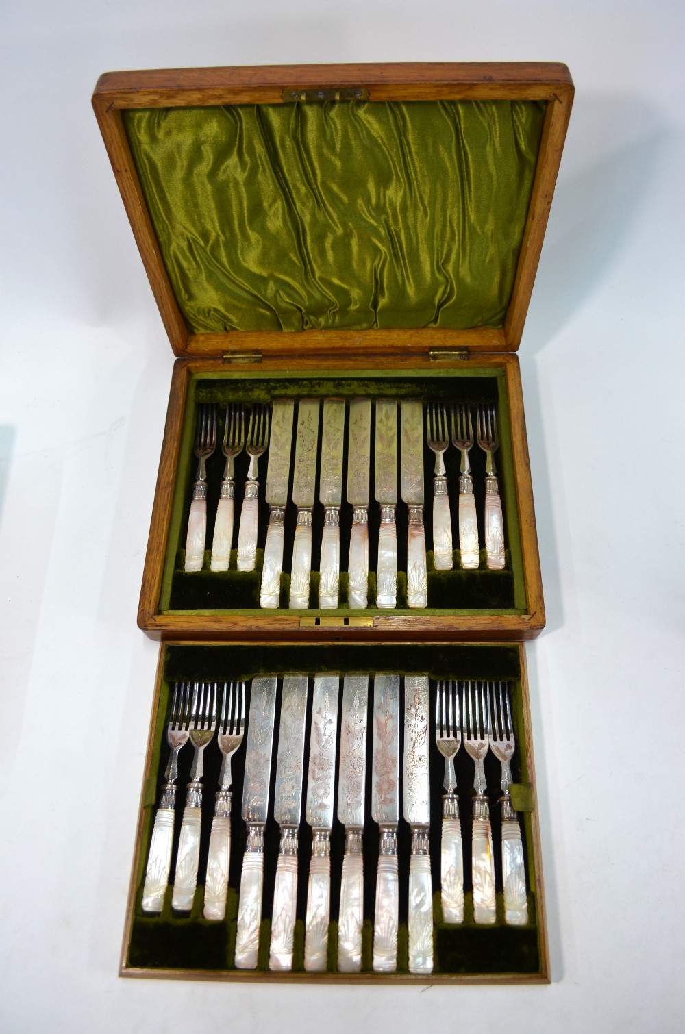 An oak-cased set of twelve Victorian engraved electroplated dessert knives and forks with carved - Image 2 of 8