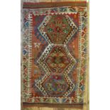 A 19th century Anatolian kelim, the triple lozenge design on pale multi-coloured ground, 152 x 0.