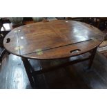 A mahogany butler's tray on stand as a coffee table, brass fittings,