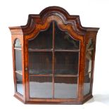 A 19th century Dutch floral marquetry walnut hanging display cabinet with moulded arched top over