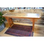 An antique Chinese elm high altar table, the single wide plank top over a fret cut cloud frieze,
