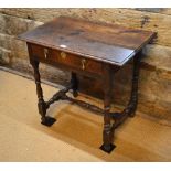 An 18th century oak side table,