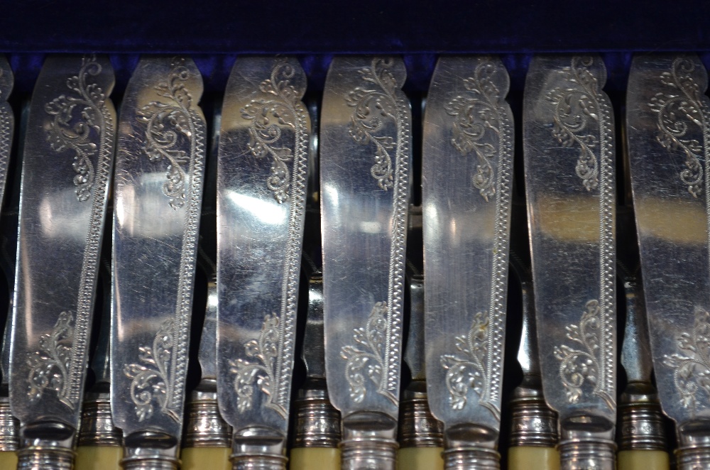 An oak-cased set of twelve Victorian engraved electroplated dessert knives and forks with carved - Image 6 of 8