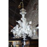 A Murano glass electrolier formed with six scroll arms,