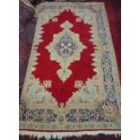 Persian Kirman red ground rug,