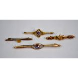 Four bar brooches, two set with amethyst, one set with smokey quartz,