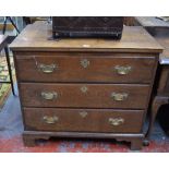 An 18th century oak chest of three long graduated drawers raised on shaped bracket feet,