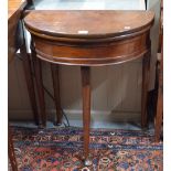 A Georgian style mahogany demi-lune double fold over table with storage well,