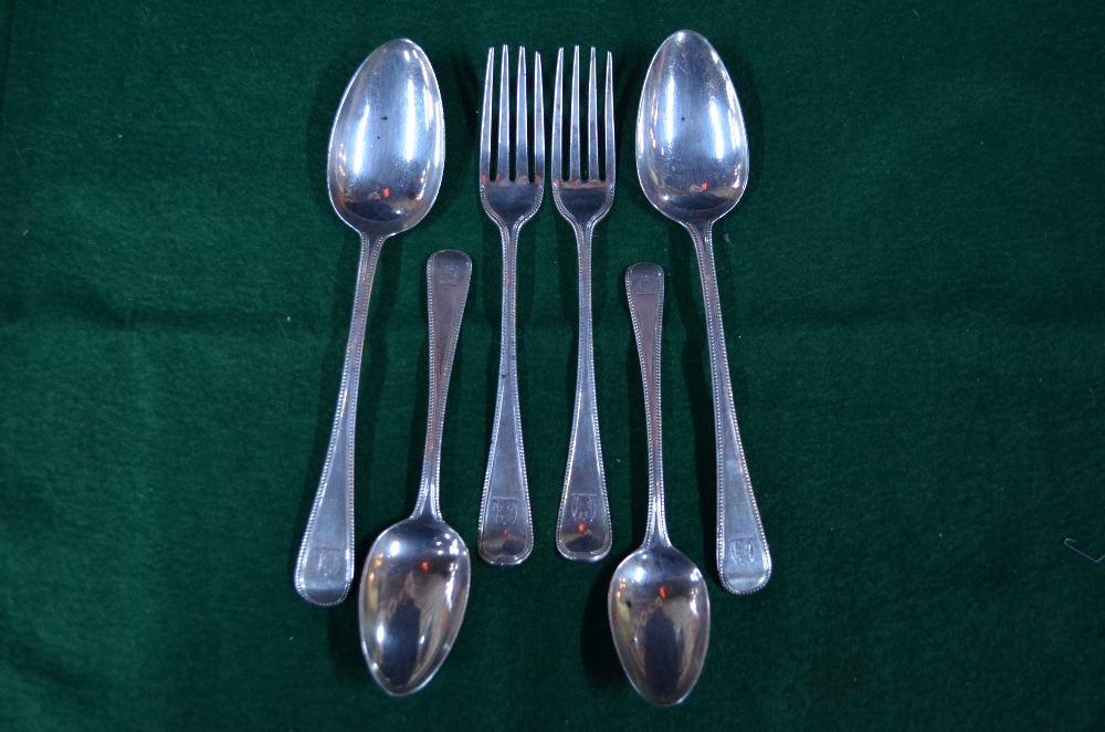 A pair of Georgian bead-edge table spoons,