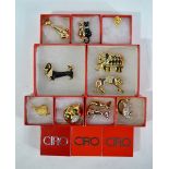 A large collection of gilt metal and mostly paste-set animal brooches including big cats, elephants,