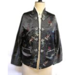 A Chinese floral embroidered blue silk satin jacket, reversible ivory,