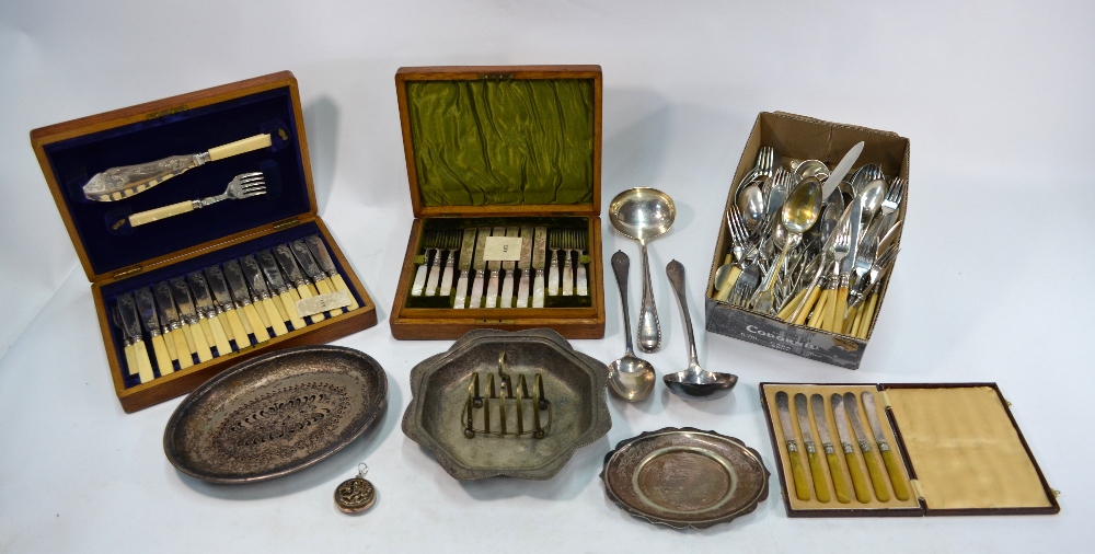 An oak-cased set of twelve Victorian engraved electroplated dessert knives and forks with carved