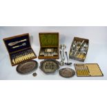 An oak-cased set of twelve Victorian engraved electroplated dessert knives and forks with carved