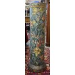 A late 19th century German large glazed terracotta drain-pipe painted with a profusion of tulips