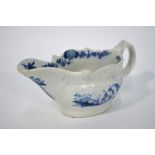 The Coysh Collection - An 18th century blue and white small creamer painted with Chinoiserie scenes,