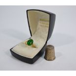 An oval green jade single stone ring,