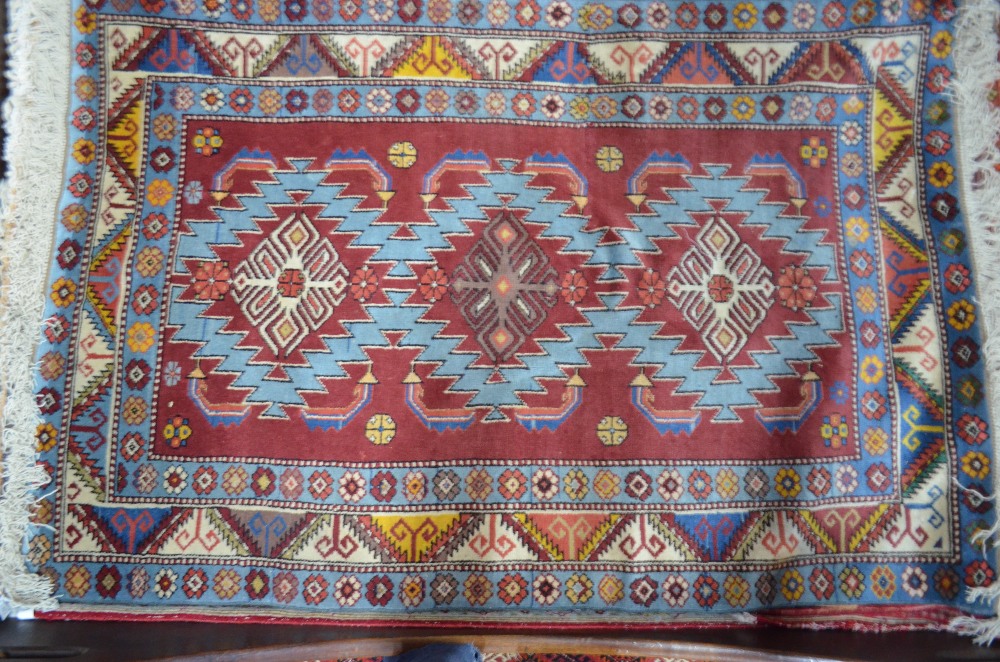 WITHDRAWN An old Anatolian Kuba triple pole design rug, on blue ground, - Image 2 of 3