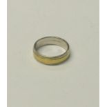 A 9ct white and yellow gold band ring, a