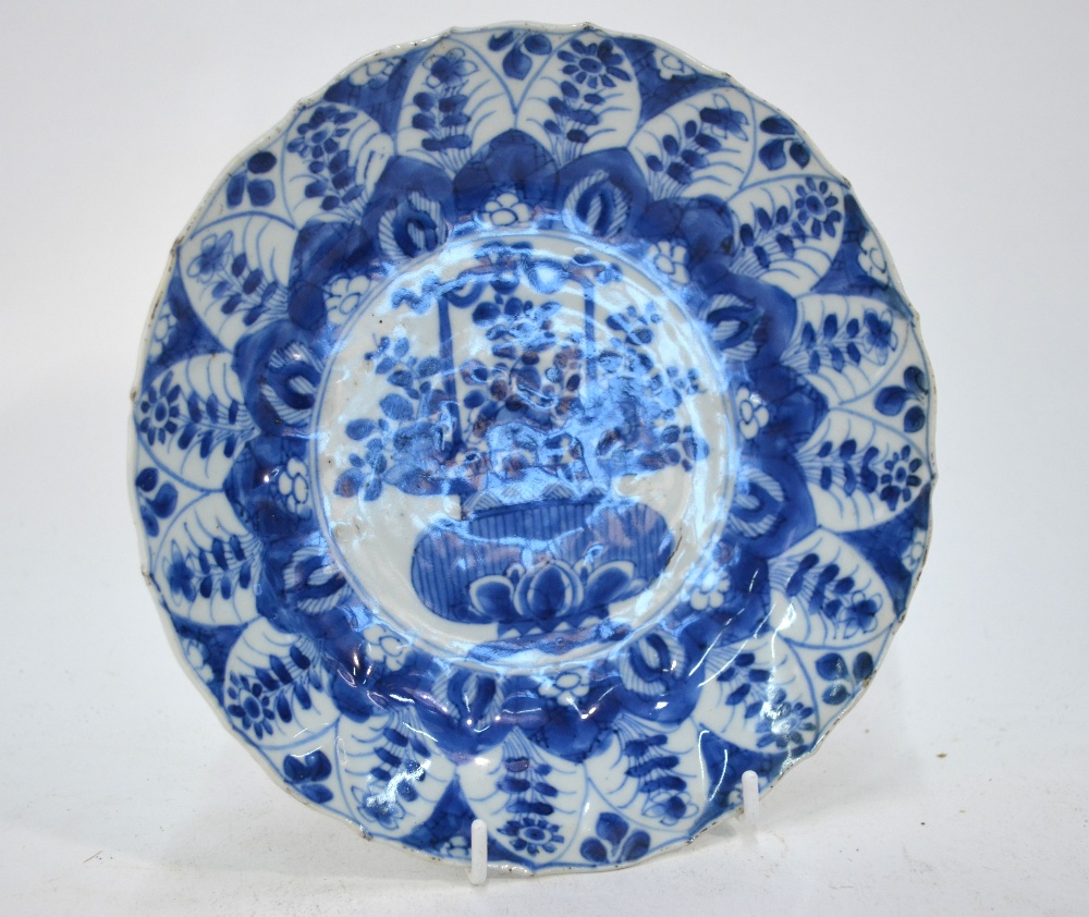 A Chinese blue and white dish, decorated with a central panel of a flower arrangement, 20. - Image 2 of 4