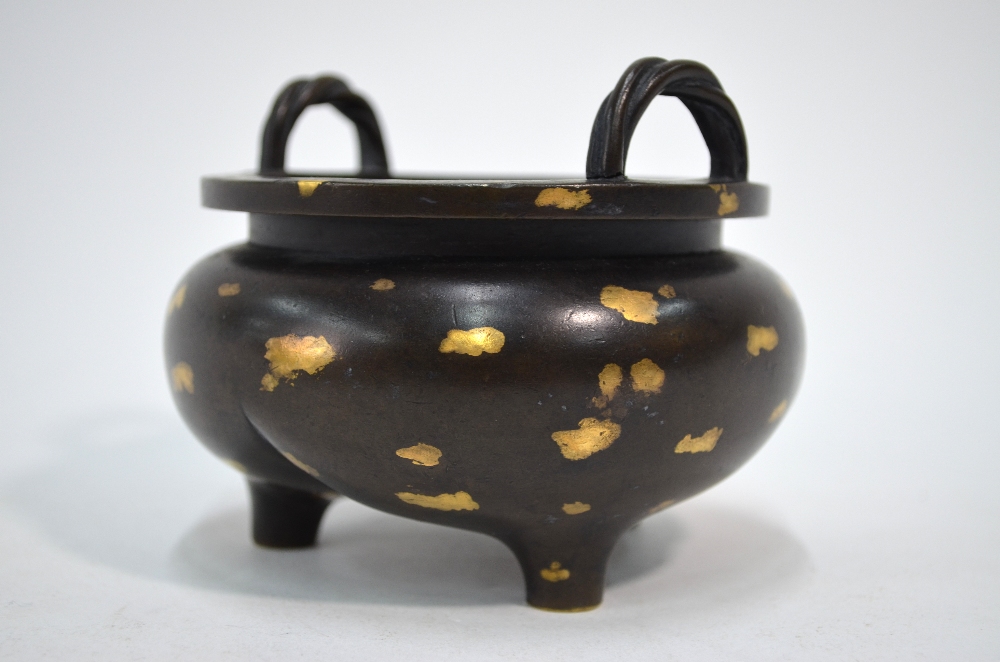 A Chinese bronze incense burner of tripod and circular form with rope-twist handles, - Image 2 of 5