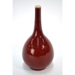A Chinese sang-de-boeuf/langyao style monochrome bottle vase with typical,