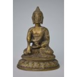A gilt metal figure of a Buddhist Deity,
