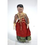 A 19th century painted wood peg doll wit