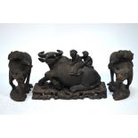 A trio of late 19th/20th century Chinese carved figures;