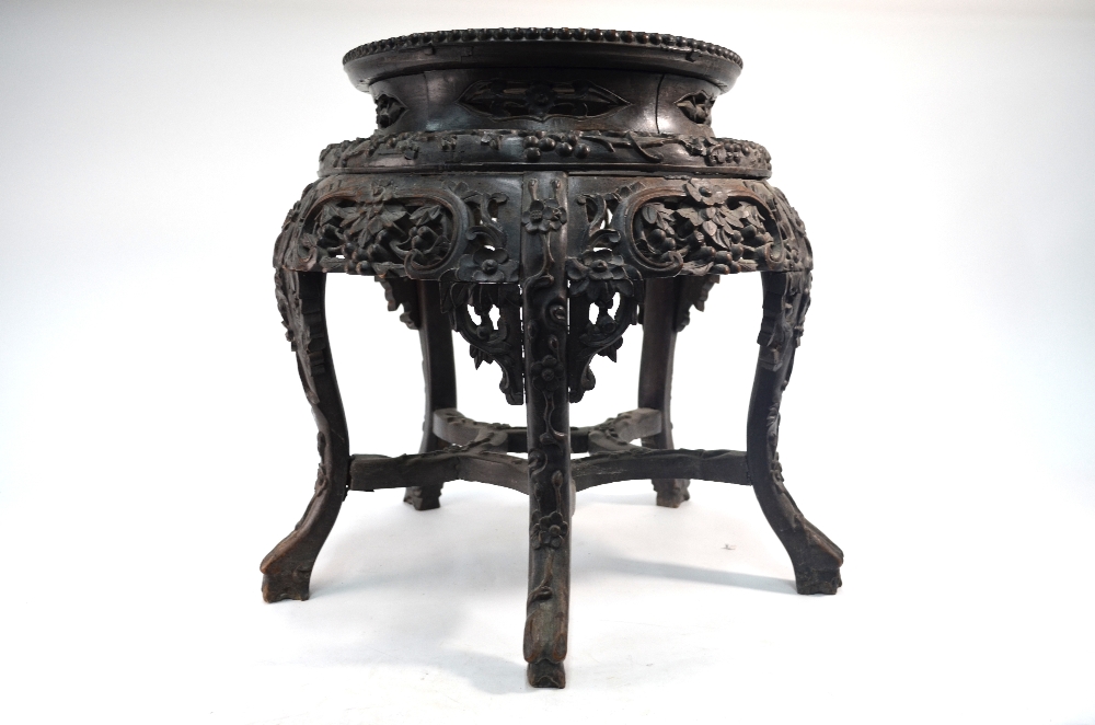 A Chinese wood and marble (or other stone) stand of typical cylindrical and reticulated form, - Image 3 of 5