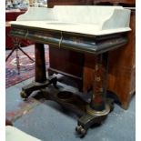 A Victorian veined white marble topped washstand raised on an ebonised polychrome and gilt decorated