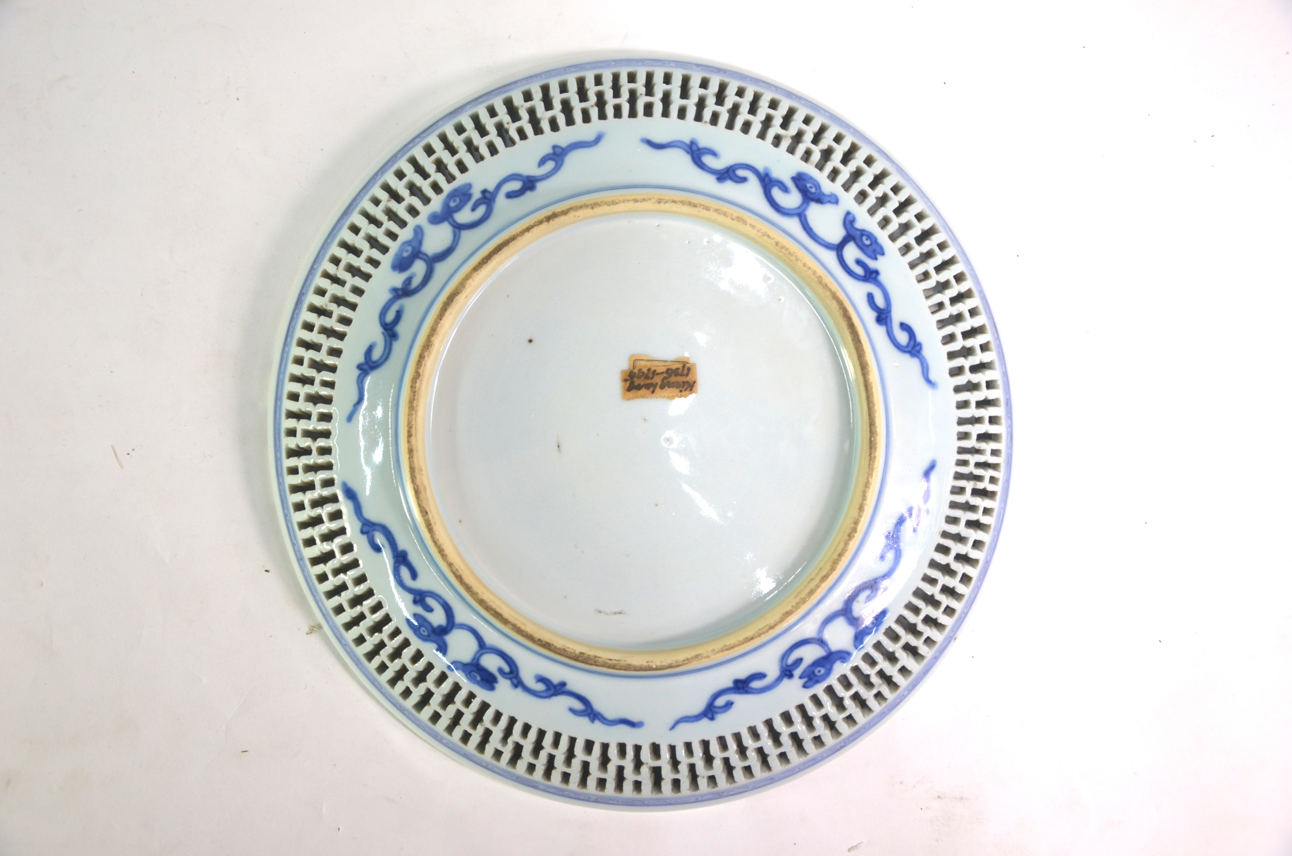 A blue and white dish of circular form with reticulated rim; decorated with a fisherman in a - Image 4 of 6