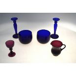 Two 19th century Bristol blue glass wine glass cooler and a pair of candlesticks, 17.5 cm high to/